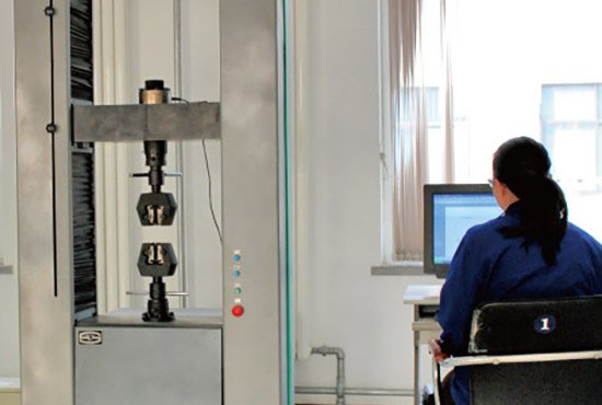 Tensile testing equipment used to verify specified nickel alloy casting mechanical properties